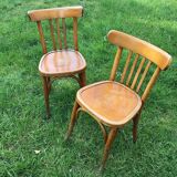 Lot of two wooden bistro chairs