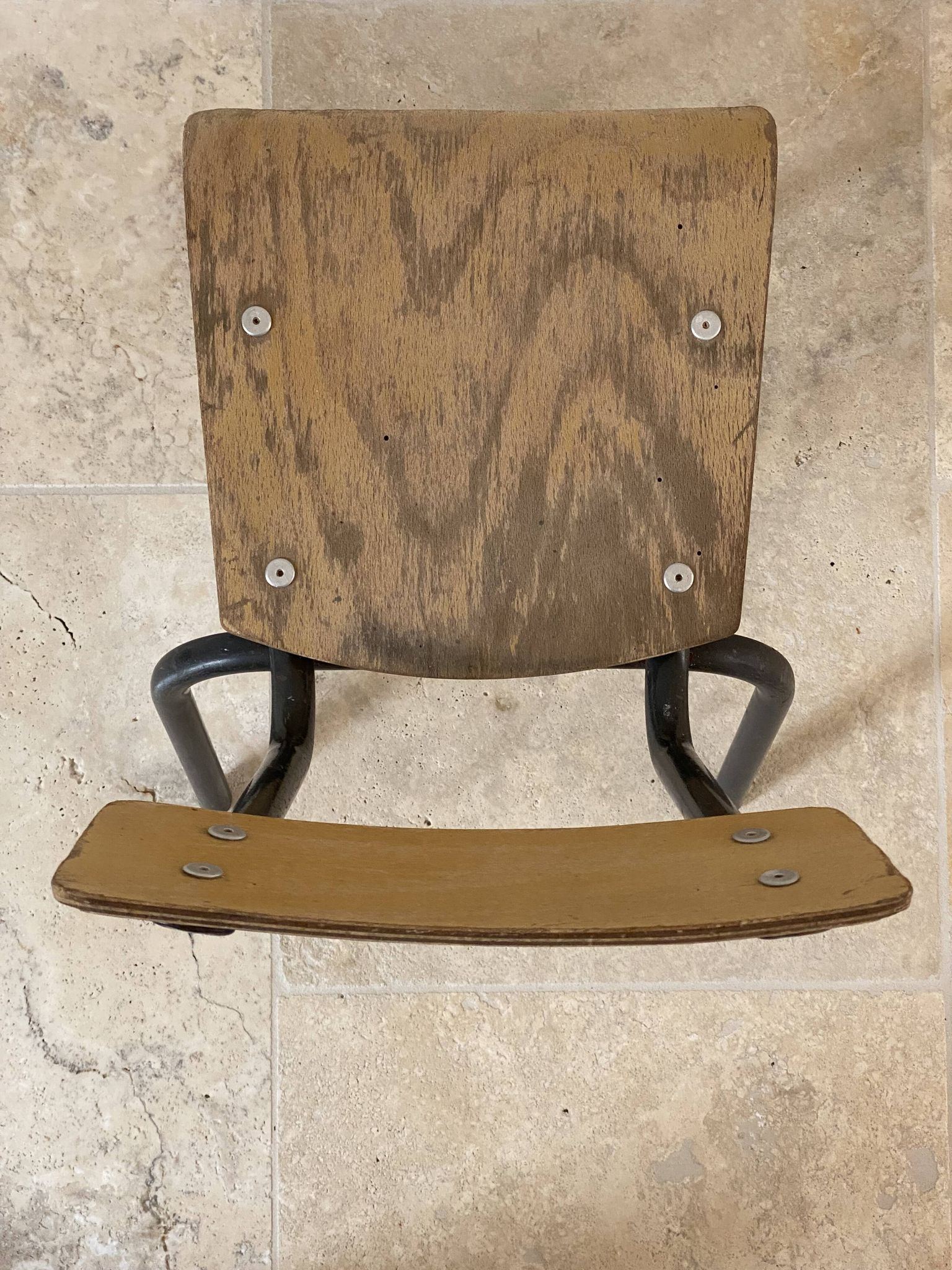 Vintage children's school chair in wood and black metal, industrial style.