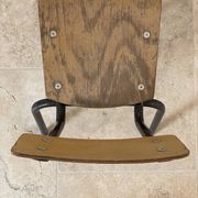 Vintage children's school chair in wood and black metal, industrial style.