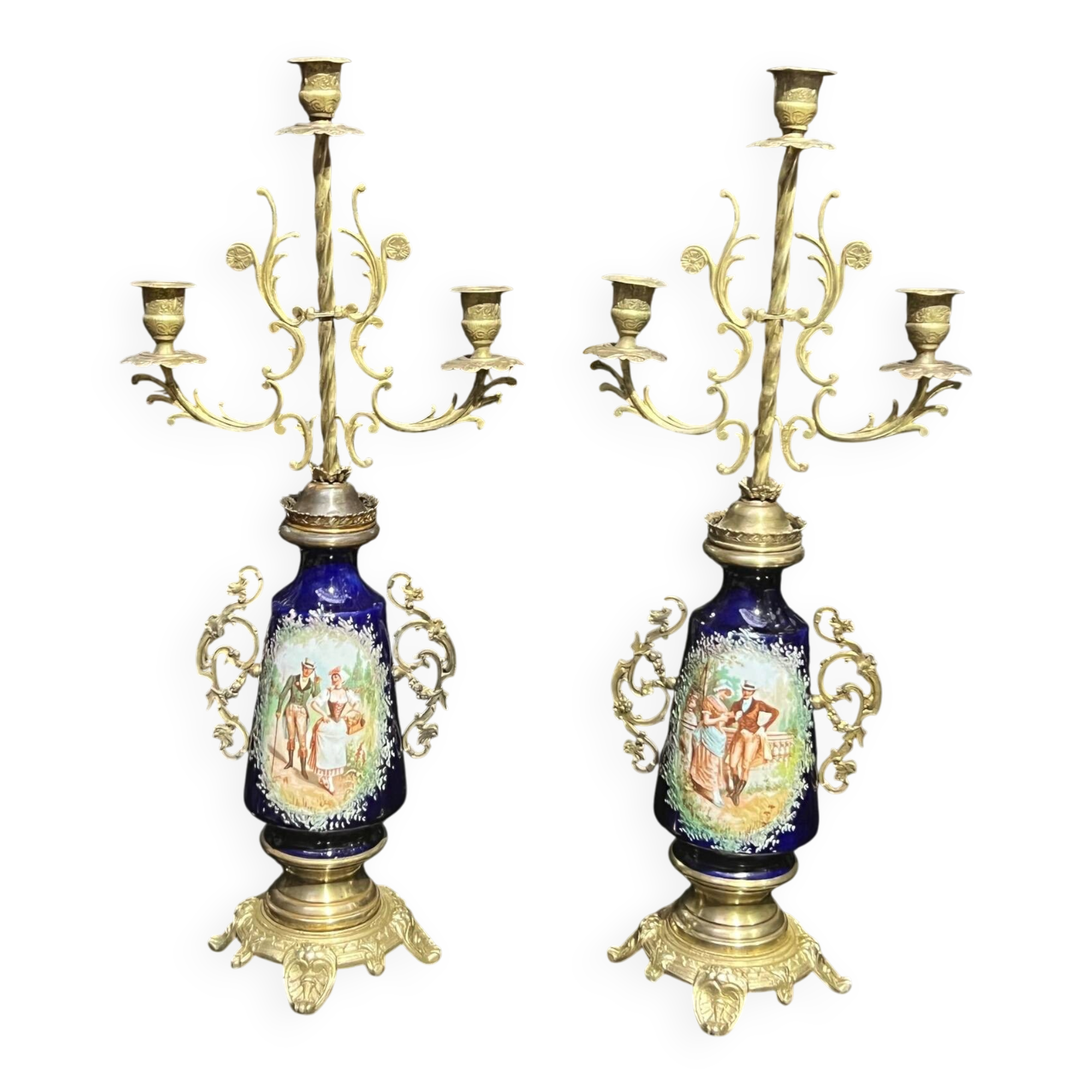 Pair of candlesticks. Bronze, brass, porcelain.
