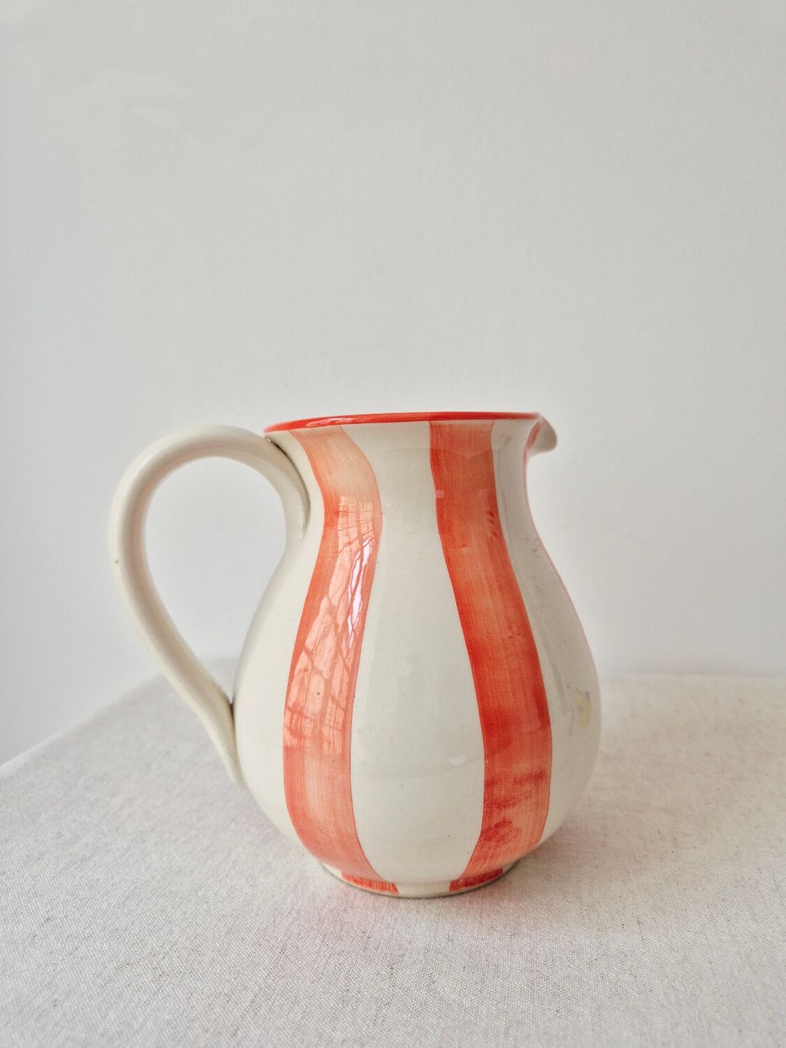 Vintage ceramic vase/pitcher with handmade mandarin stripes.