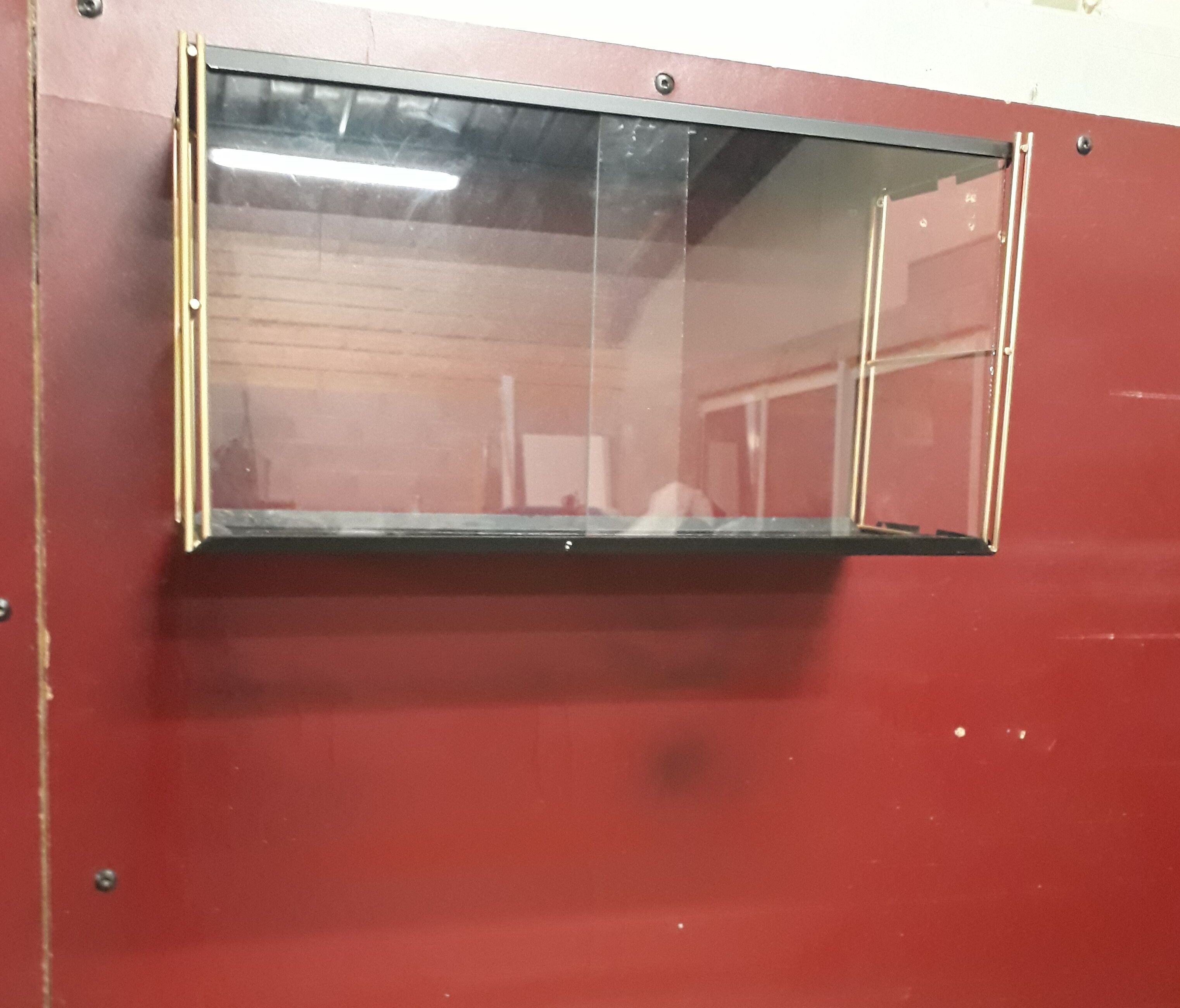 Wall-mounted Tomado showcase 1960