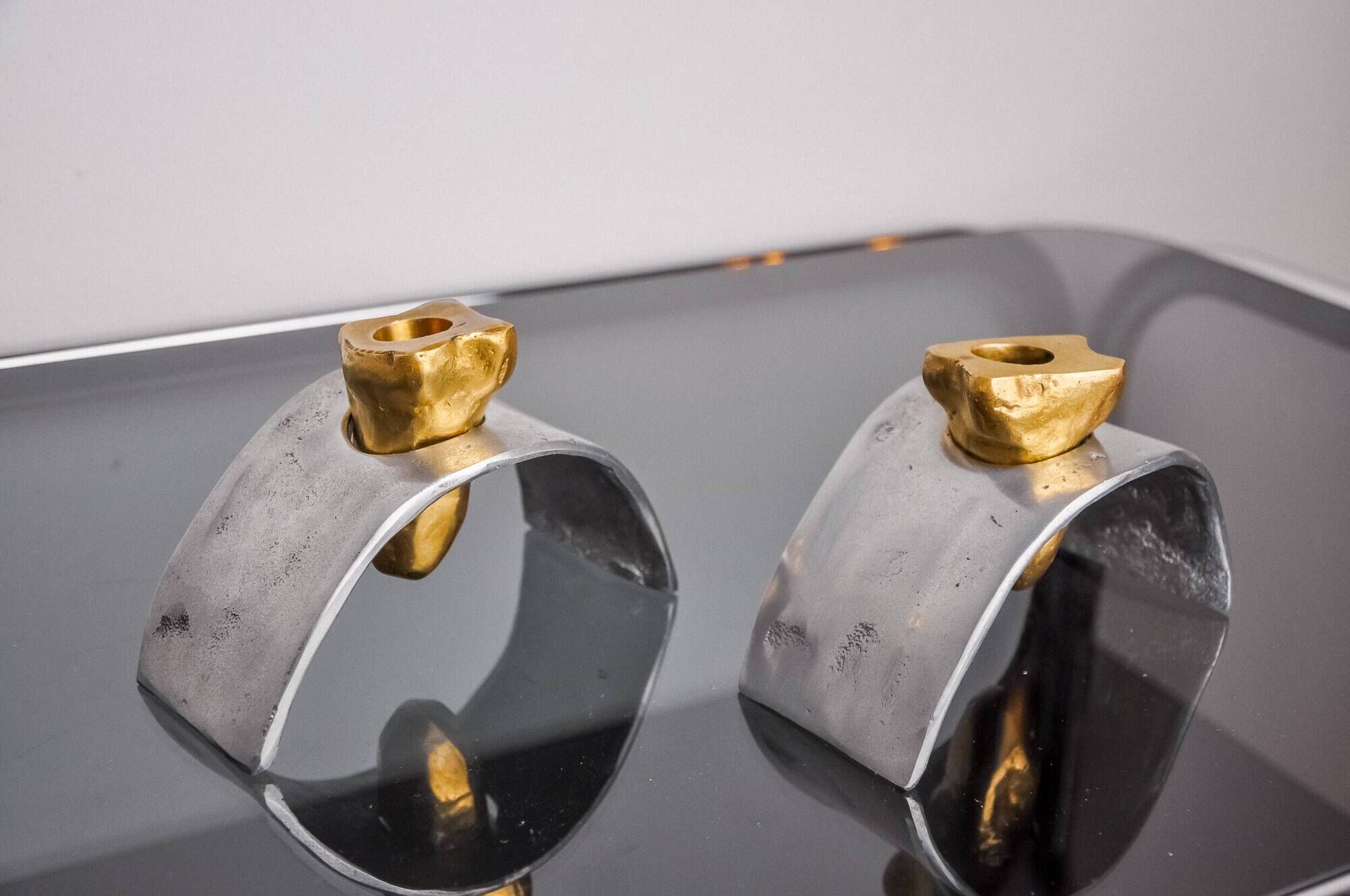 Pair of Brutalist candlesticks by David Marshall, bronze and aluminum, Spain, 1970