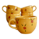 Large vintage ceramic mug in yellow with hand-painted flowers.