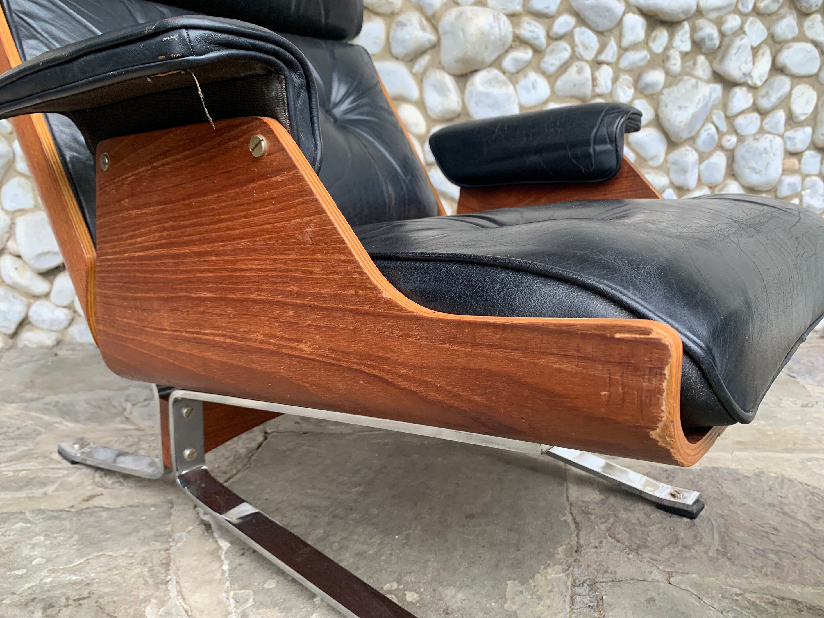 Lounge chair and ottoman black leather and teak multiplex, 1960