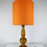 Turned wood lamp with orange shade, 1970s.