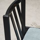 Set of 4 modernist black chairs with light blue ribbed fabric
