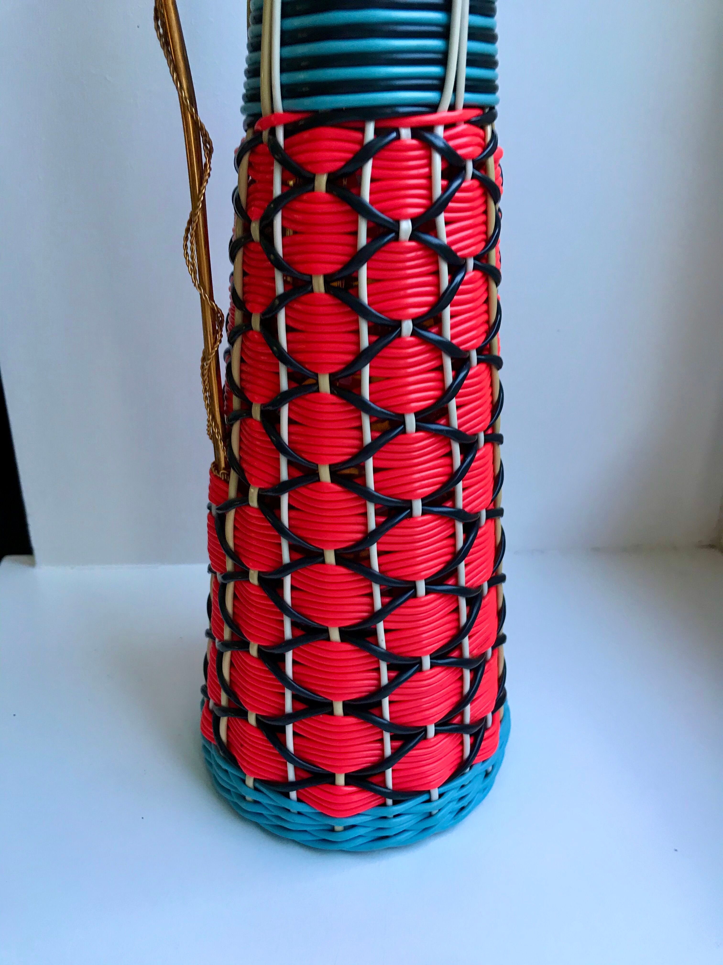 Scoubidou bottle with orange and blue and yellow brass handle 70s