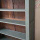 Wood and khaki green bookcase