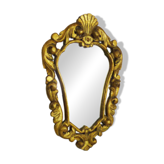 Old wall mirror in wood and gilded stucco with shell decoration, Louis XV style pediment mirror
