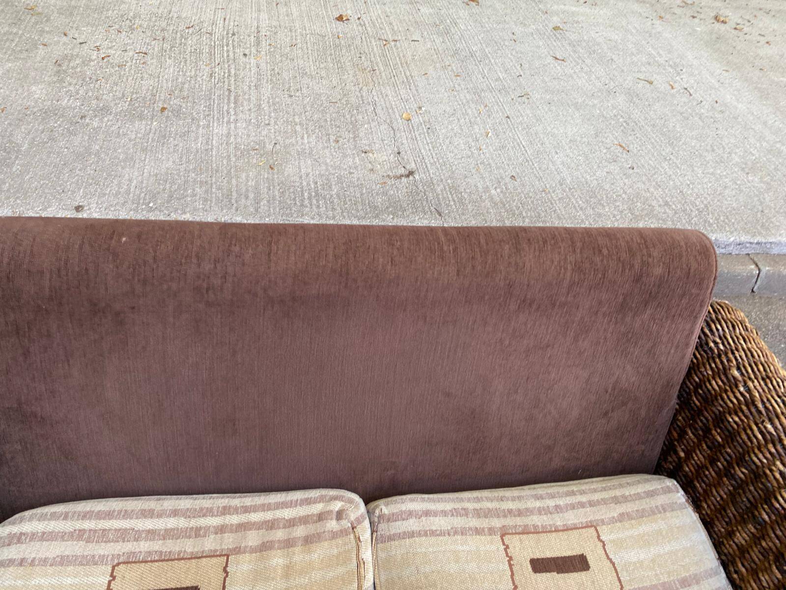 Exotic 2-seater sofa in woven banana tree / rattan and brown fabric.
