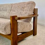 Old 3-seater sofa in solid wood, Maison Regain design, from the 70s.