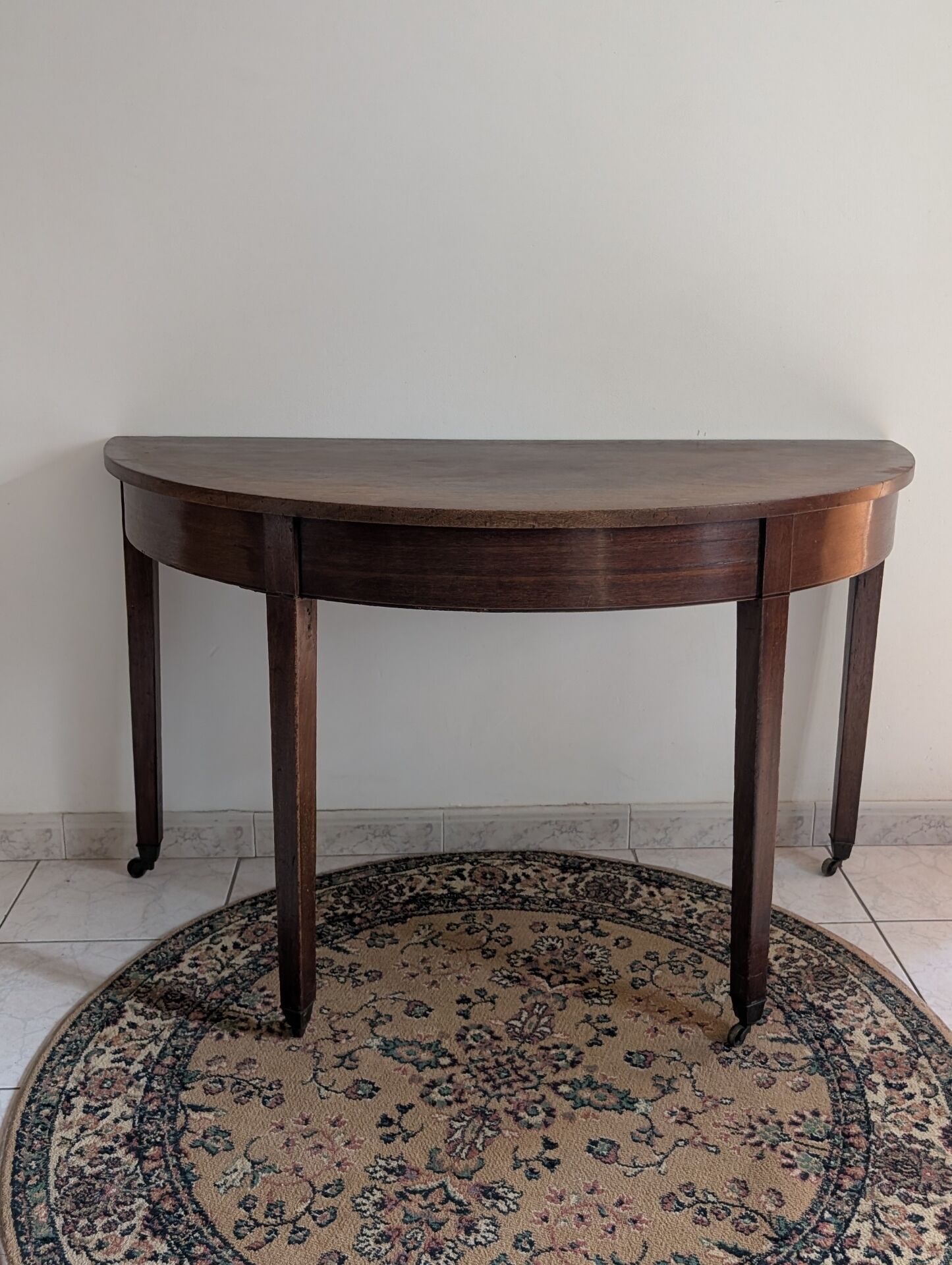Old half-moon table or serving trolley on wheels