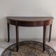 Old half-moon table or serving trolley on wheels