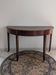 Old half-moon table or serving trolley on wheels