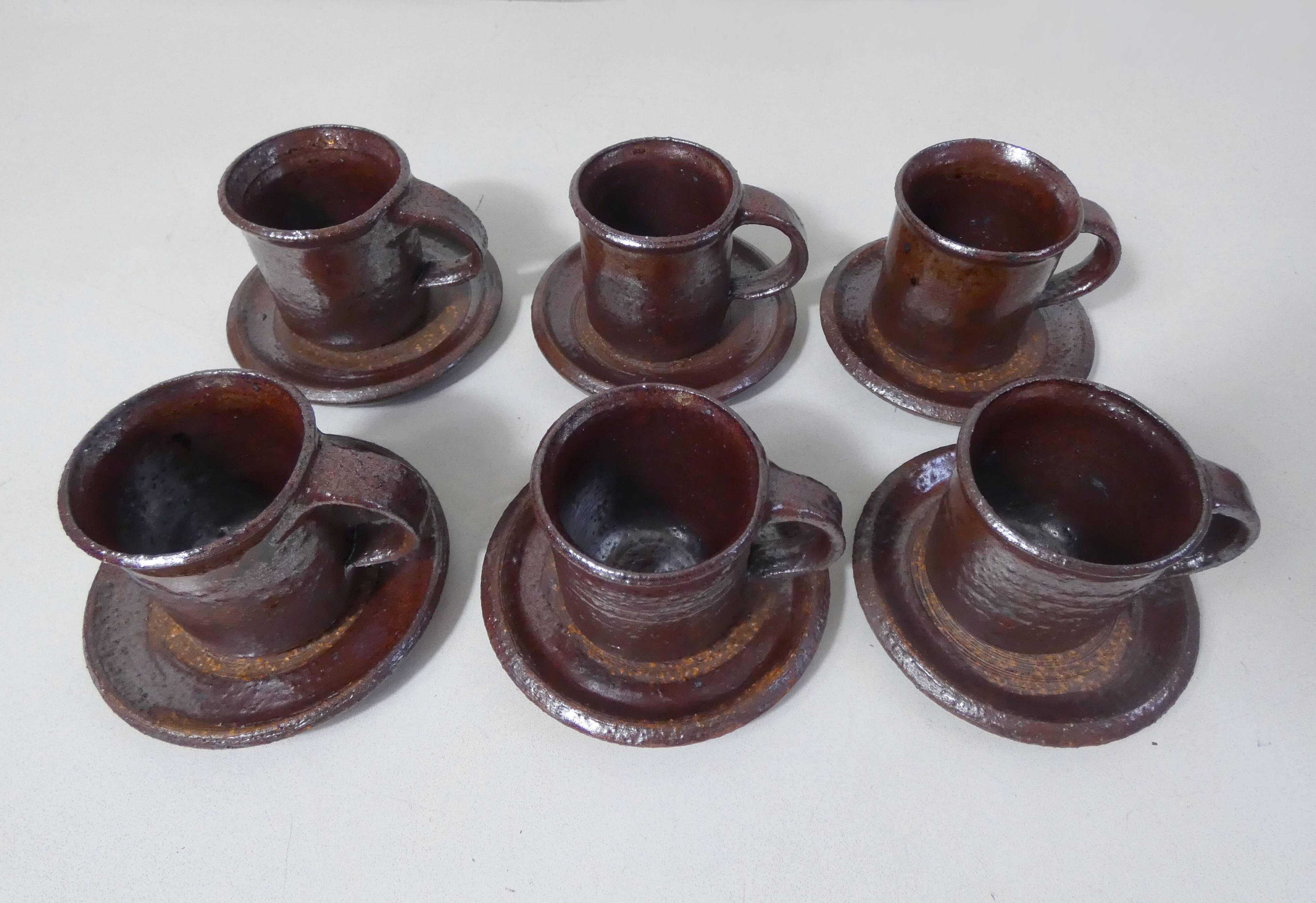 coffee service in iridescent stoneware cups and vintage sugar bowl