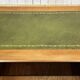 English flat desk with drawers from the 1970s in fir and leather top.