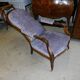 Relaxed Voltaire armchair with walnut racks