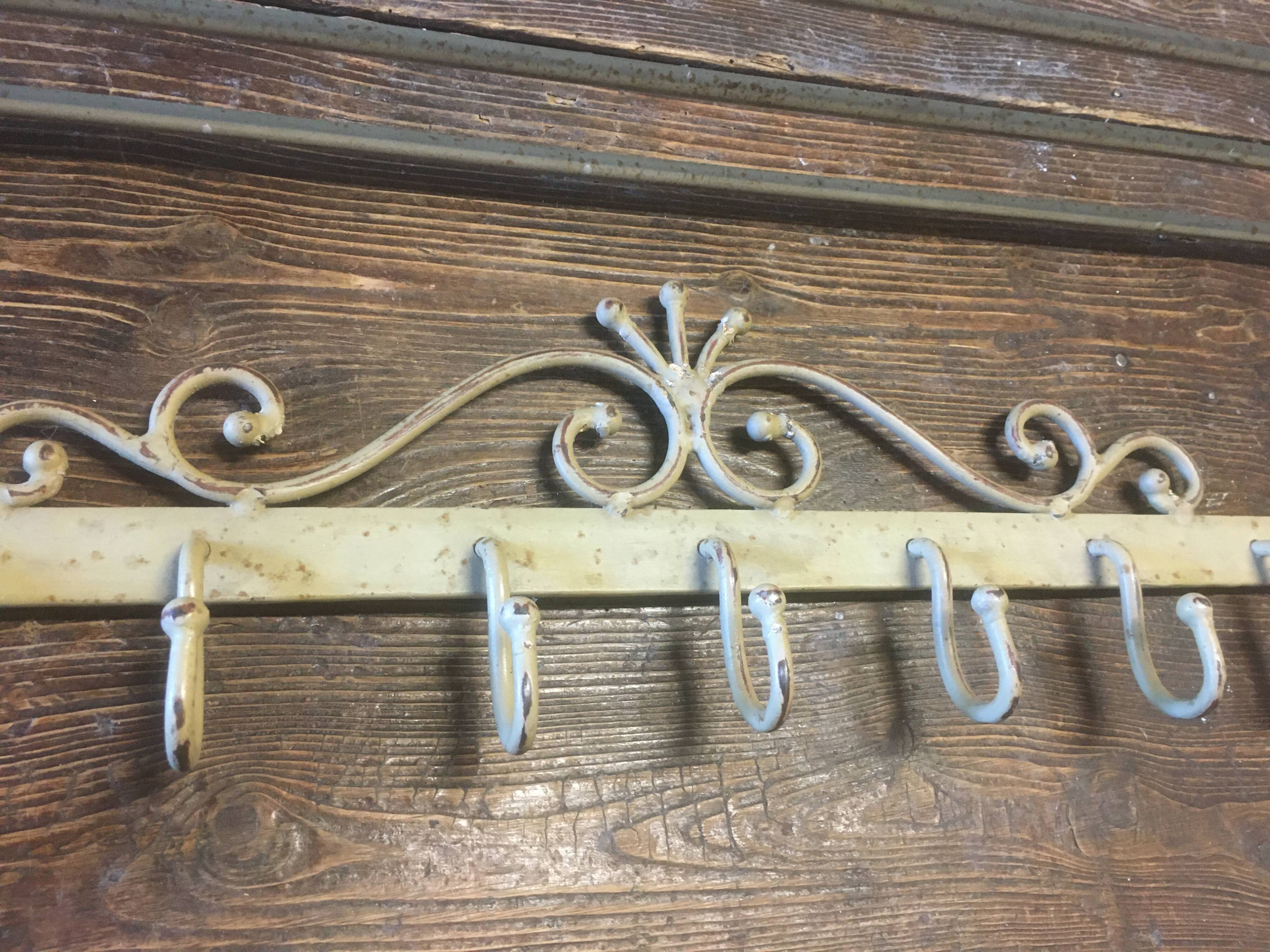 White wrought iron coat and hat rack