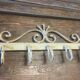 White wrought iron coat and hat rack