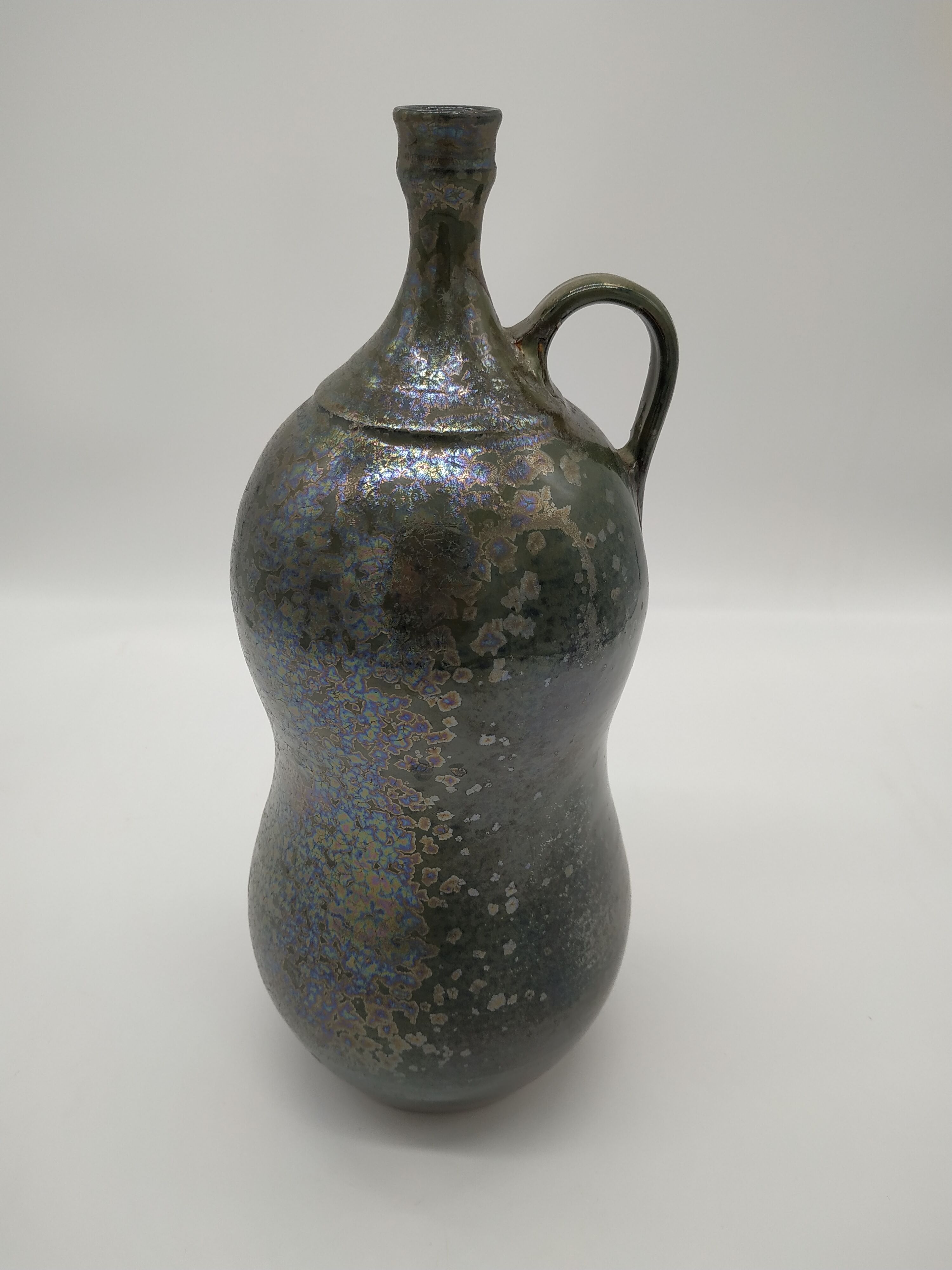 Bottle in iridescent green sandstone from the ceramist jean aimé Poirier