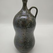 Bottle in iridescent green sandstone from the ceramist jean aimé Poirier