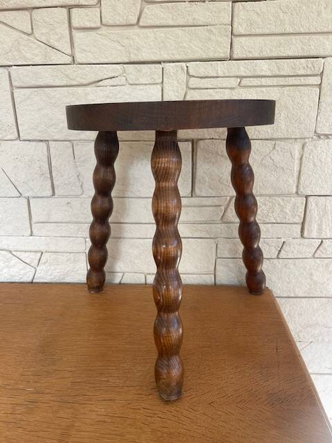 Low tripod stool with turned legs