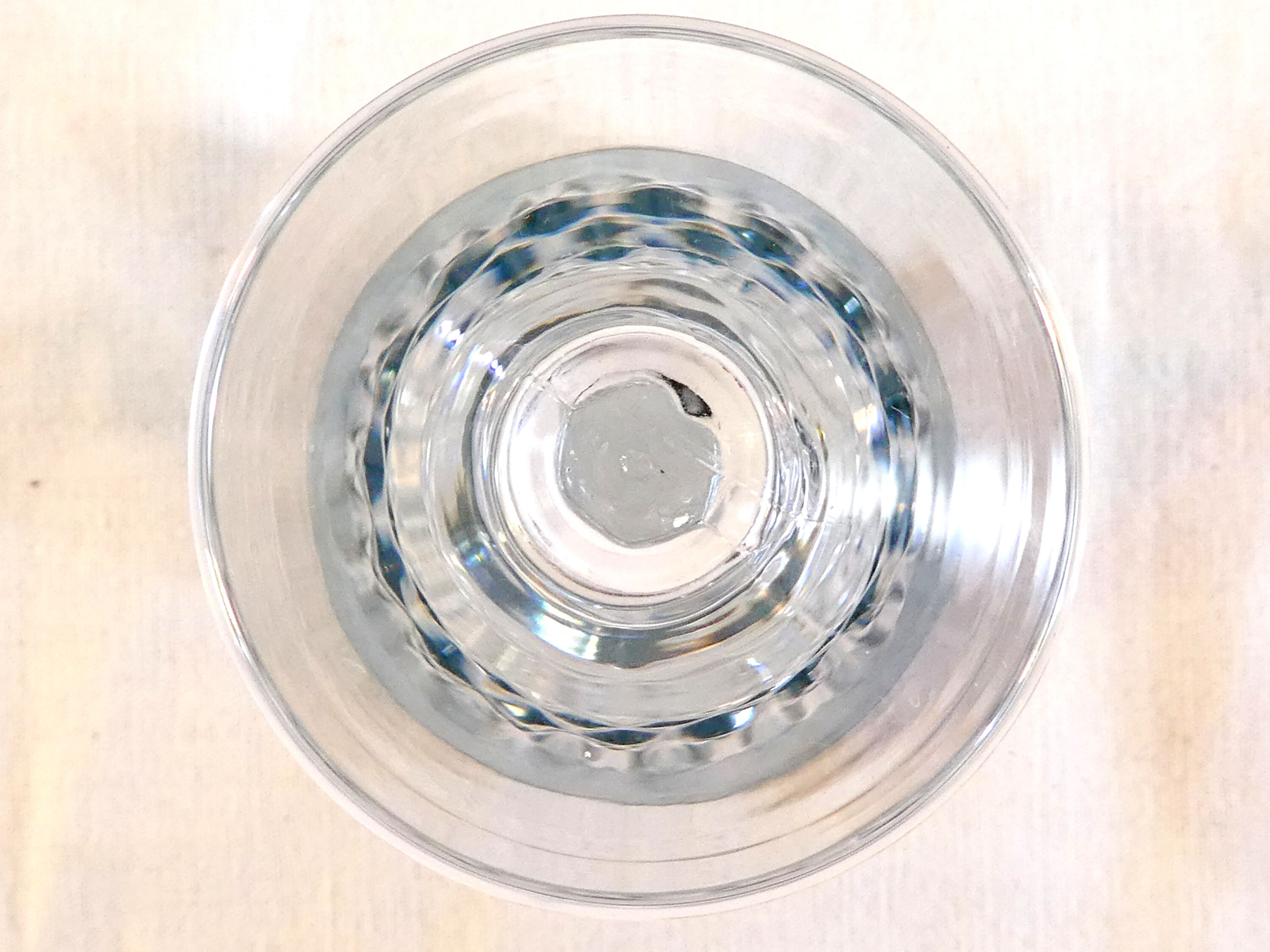 10 glasses with coloured liquor