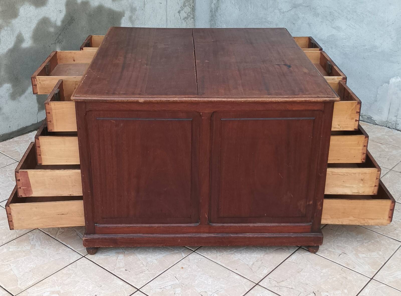 Vintage double-sided mahogany desk with 18 drawers.