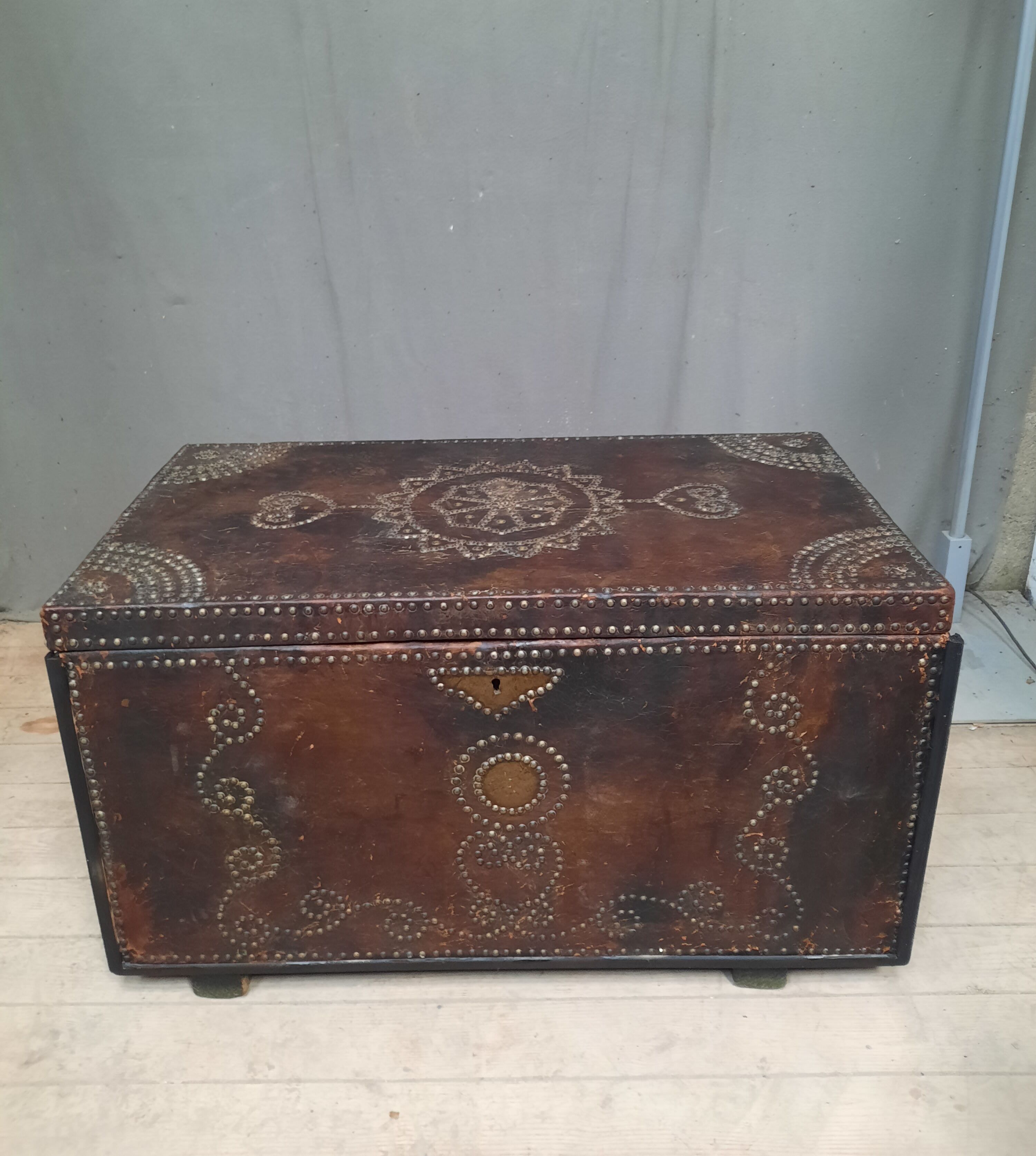 Chest covered with leather and nails