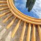 Vintage rattan sun mirror circa 1970