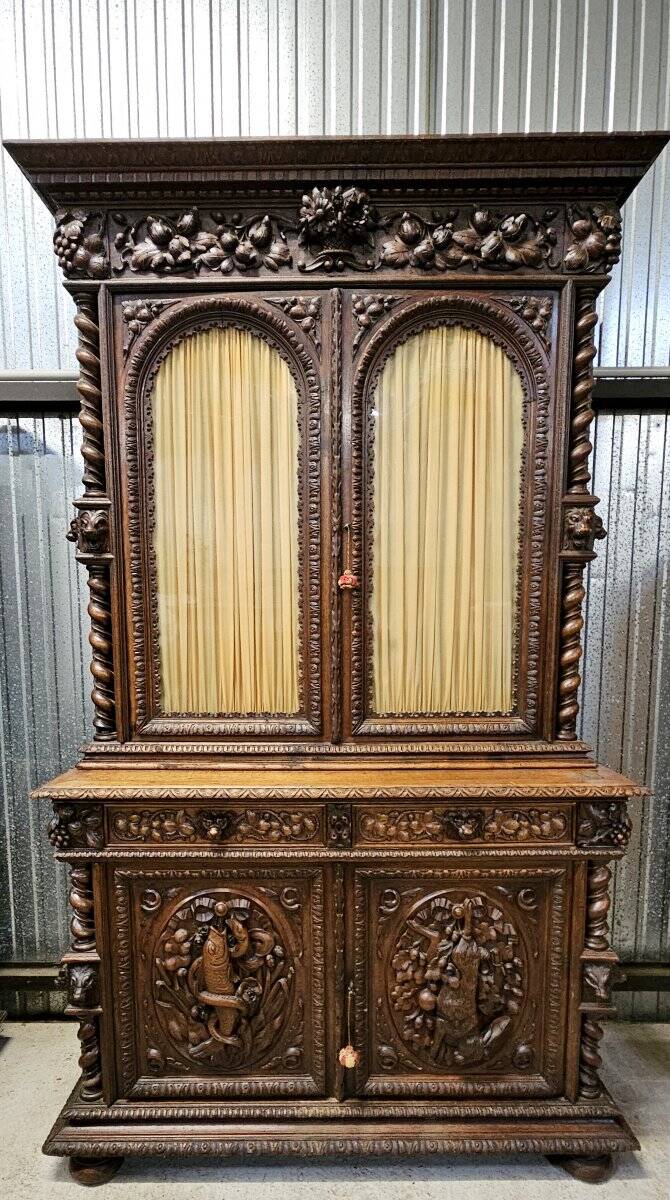 Two-body buffet in solid oak, richly carved in the Renaissance style.
