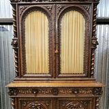 Two-body buffet in solid oak, richly carved in the Renaissance style.