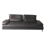 2 black leather sofas roche bobois scenario, one three-seater and one chaise longue.