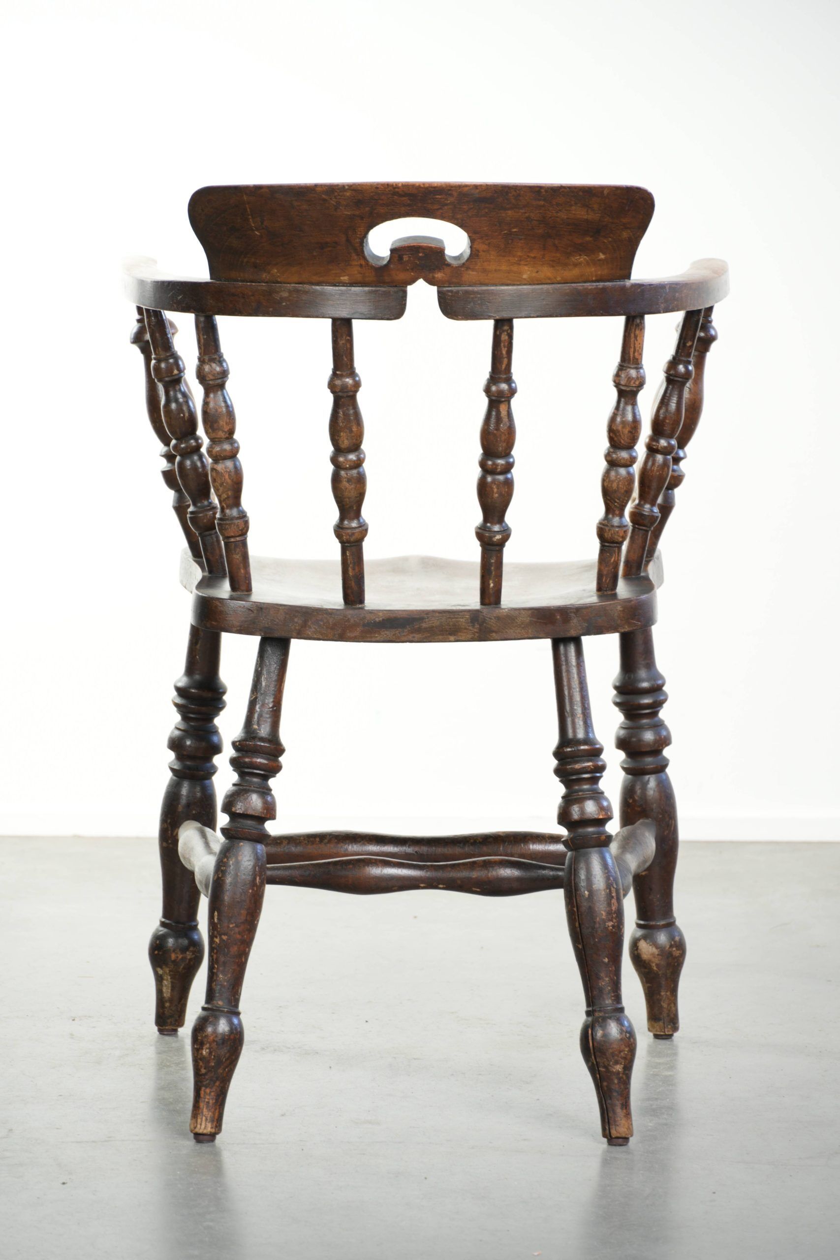 Wooden English antique pub/captain chair from the late 19th century