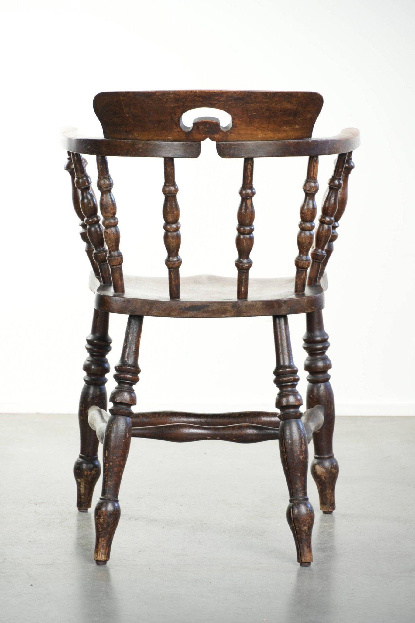 Wooden English antique pub/captain chair from the late 19th century