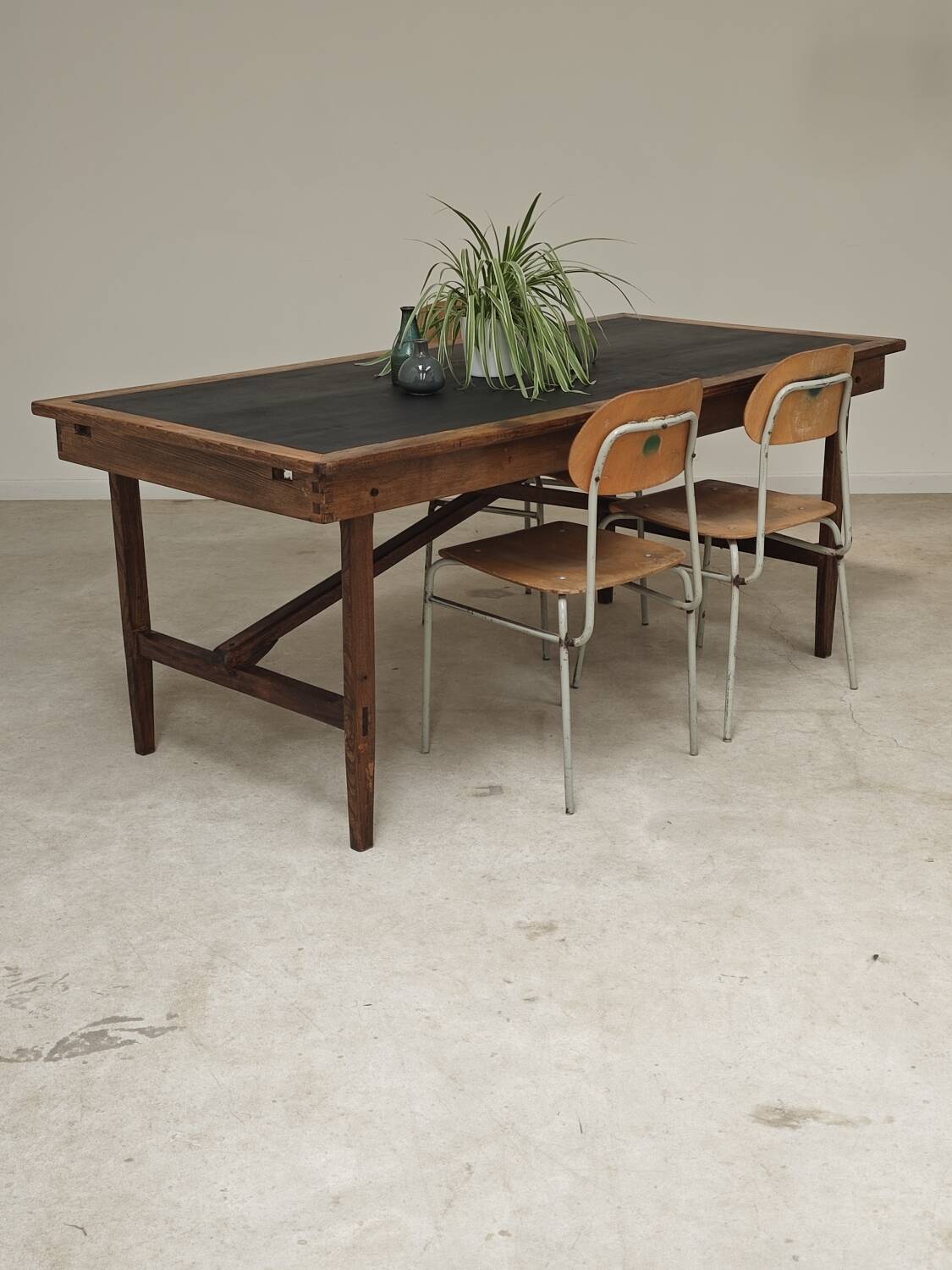 Vintage workshop folding table in oak with a hand-patinated black top.