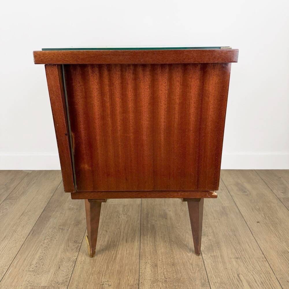 1950s bedside table in varnished wood veneer and brass.