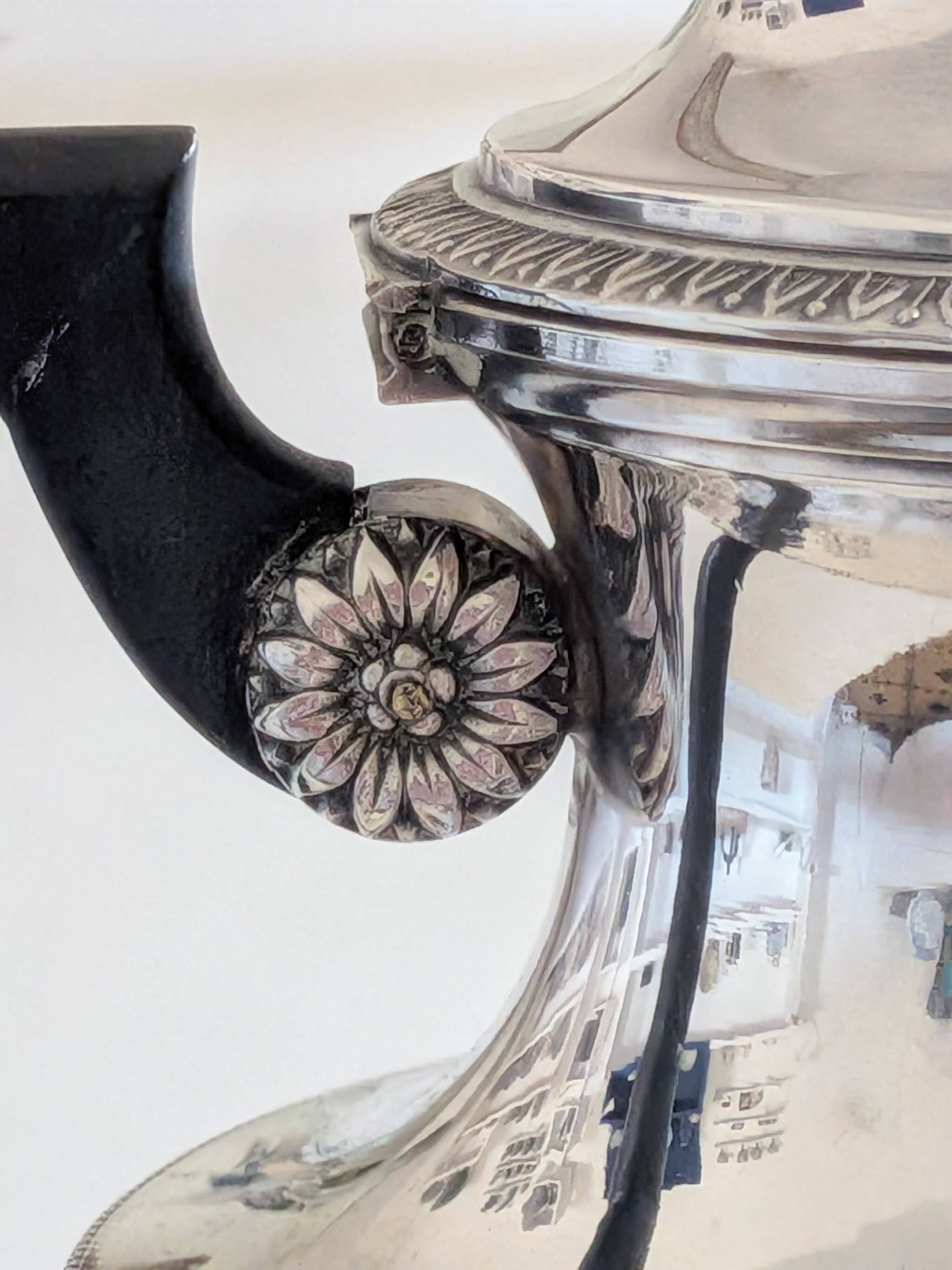 Empire-style silver-plated coffee pot with eagle head spout.