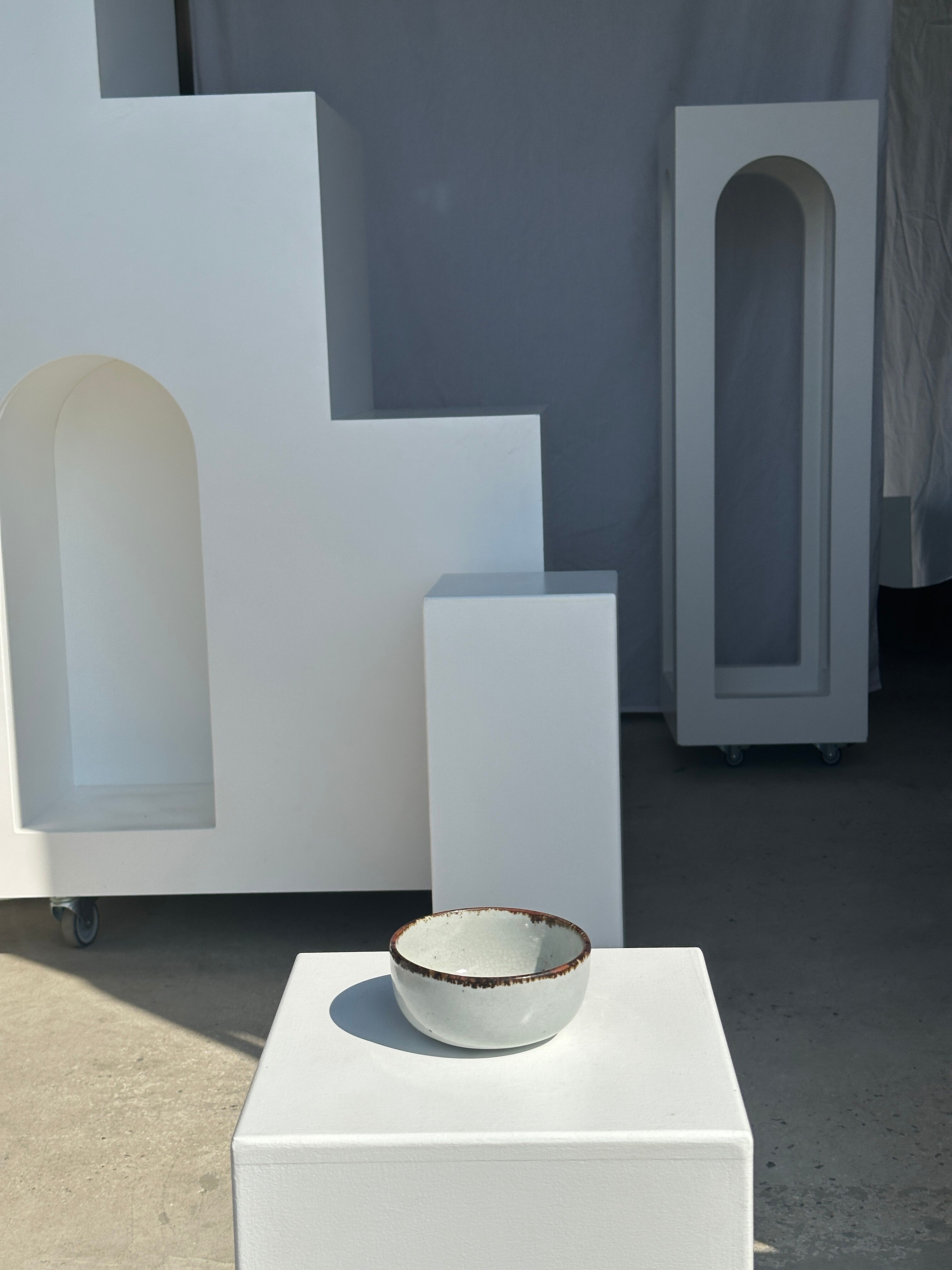 Small white glazed ceramic bowl black edges