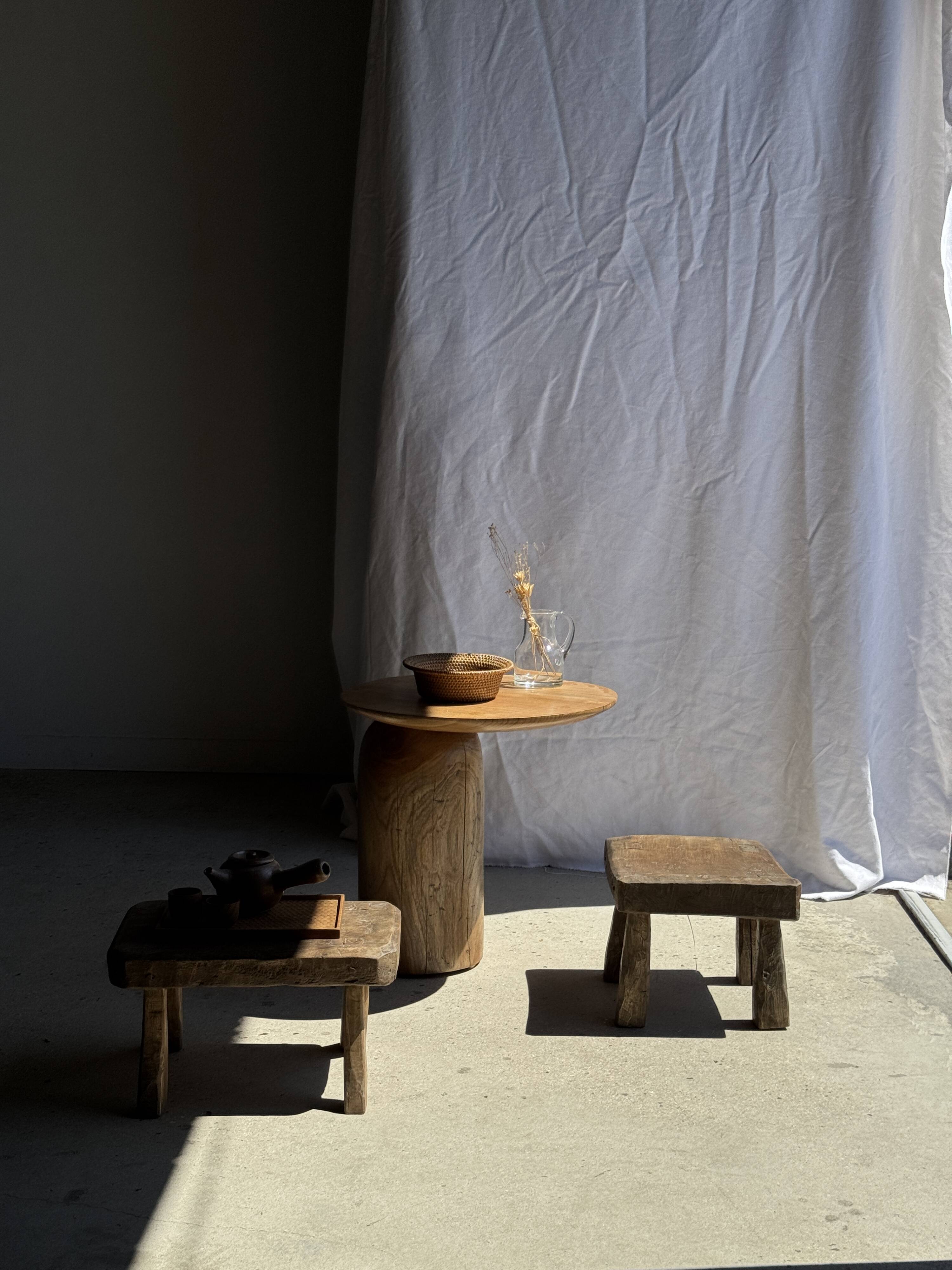 Small stool, square solid teak side table with a curved seat.