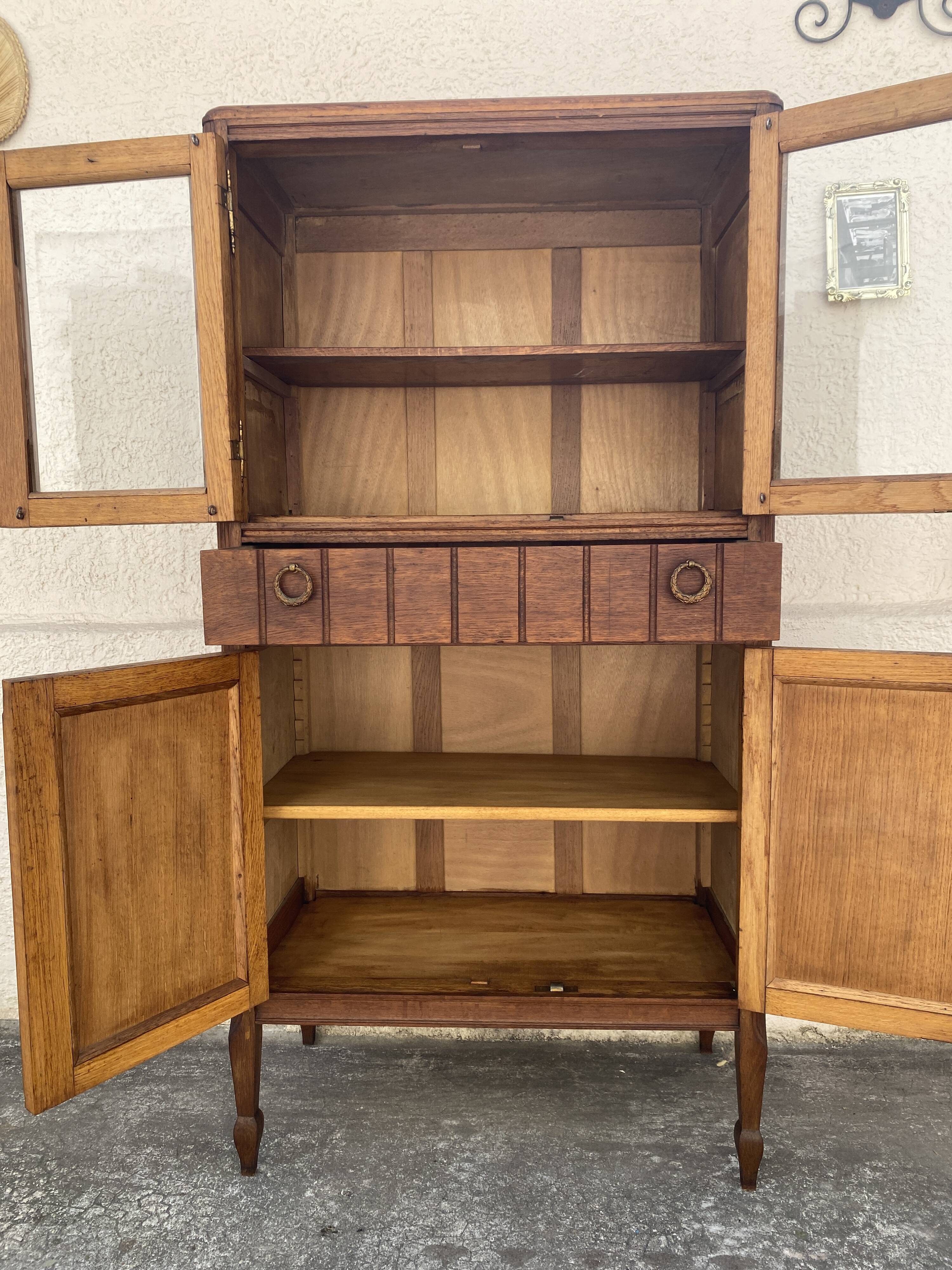 Old small glass display cabinet from the early 20th century.