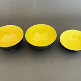 Two pitchers and three Elchinger ceramic bowls black and yellow background 1960