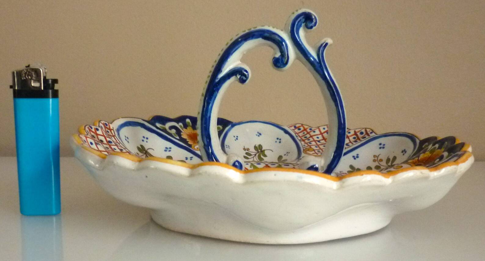 Dish, egg server in hand-painted earthenware, signed Geo Martel