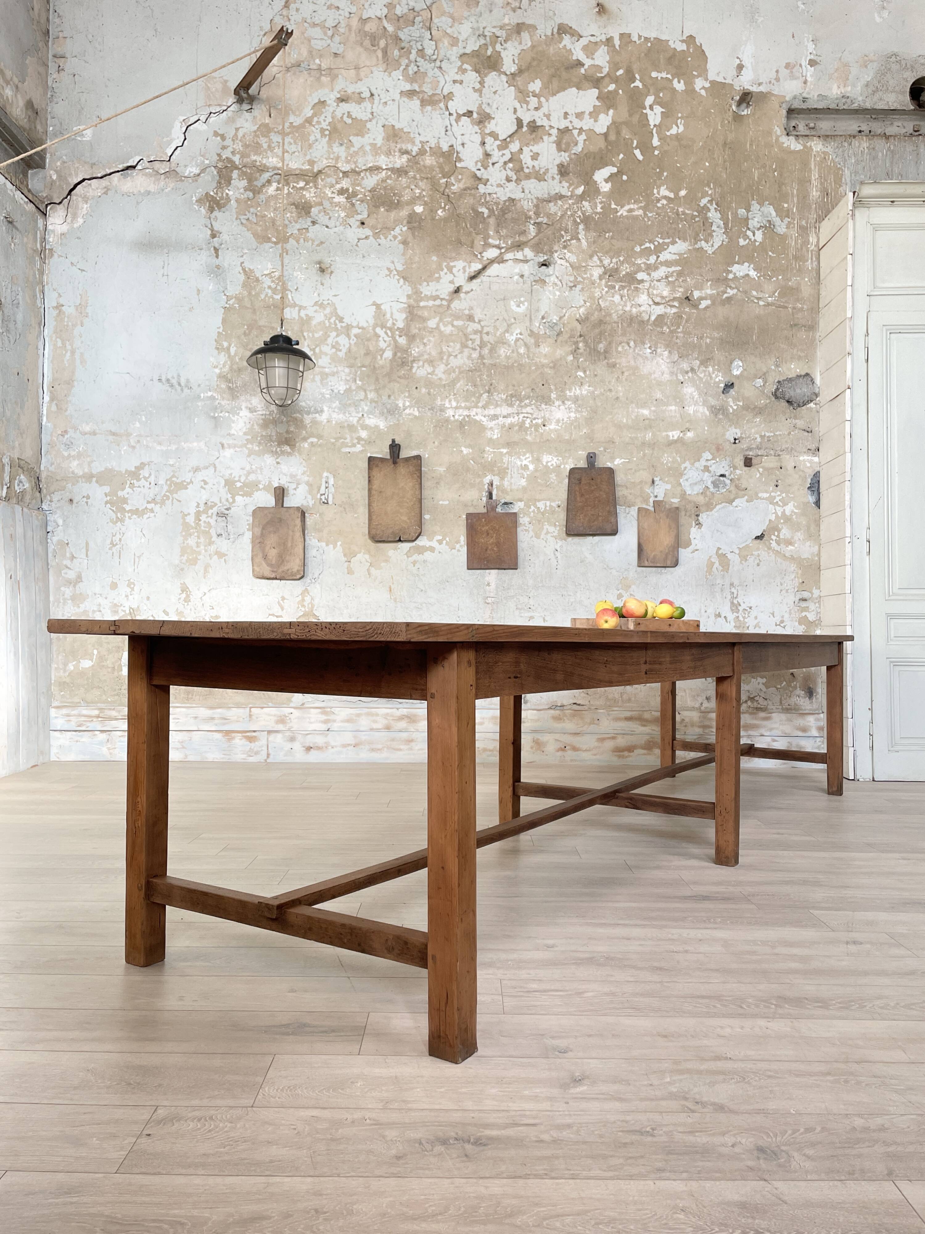 Solid wood workshop table with straight legs.