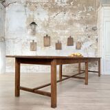 Solid wood workshop table with straight legs.