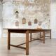 Solid wood workshop table with straight legs.