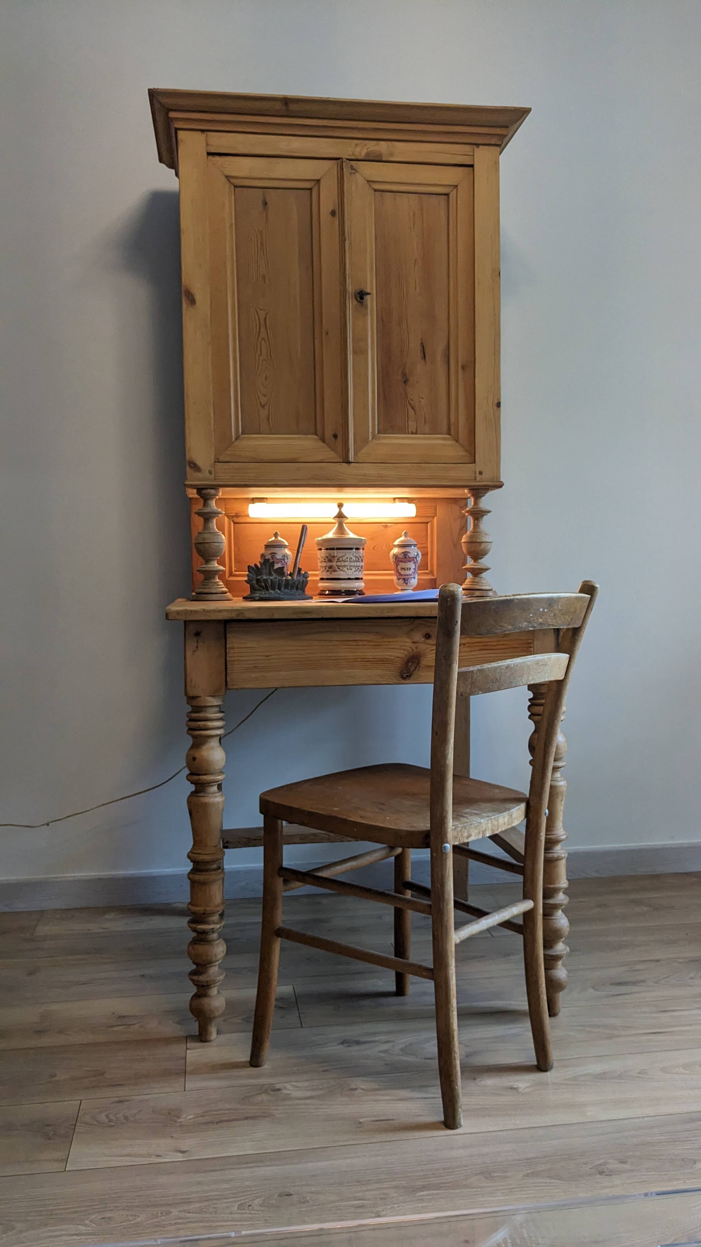 Former campaign secretary's desk in solid pine with a high cupboard.