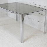 Living table. chrome metal, curved smoked glass slab, france, circa 1970.