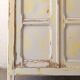 Small antique wardrobe patinated in beige and yellow.